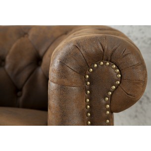 Fauteuil design chesterfield teinté marron Fauteuil design chesterfield teinté marron